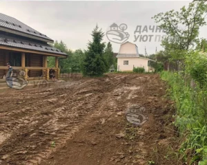 Черновое выравнивание участка техникой