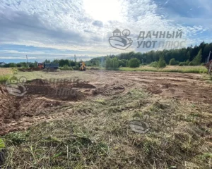 Процесс планировки участка техникой
